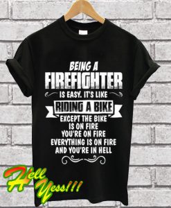 Being A Firefighter riding a bike T Shirt
